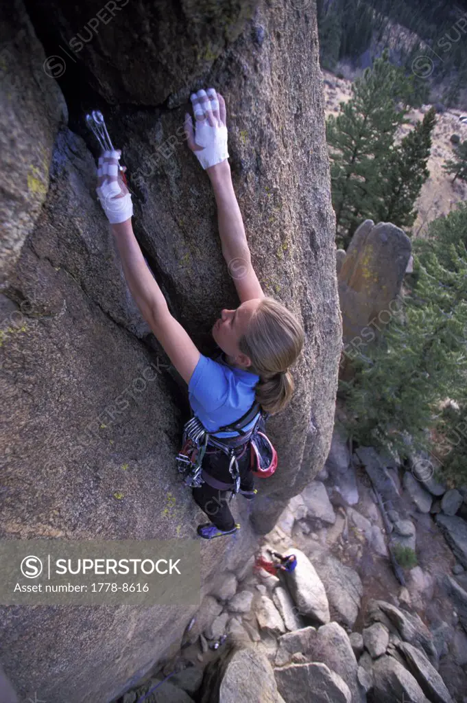 Woman rock climbing in Rocky Mountain National Park, Colorado