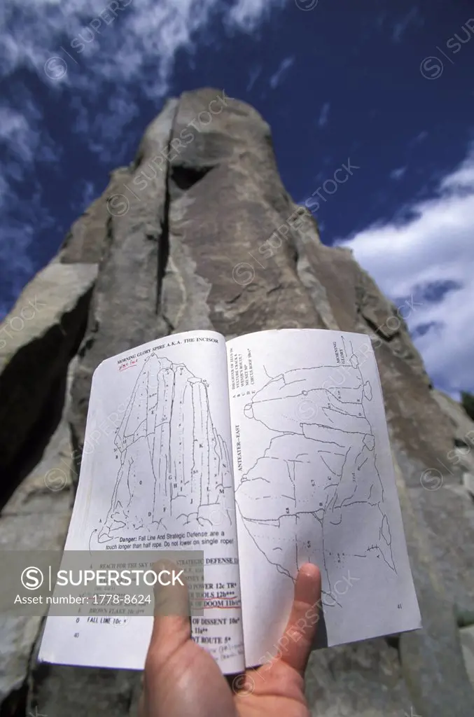 Man reading climbing topo map - rock climbing at City Of Rocks, Idaho