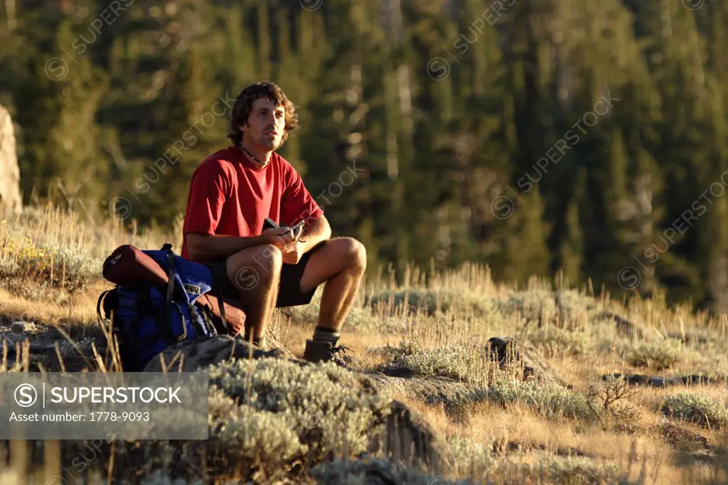 Young man backpacking near Carson Pass, CA
