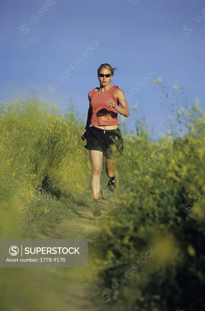 A woman running on the Lefthand trail near Boulder, CO