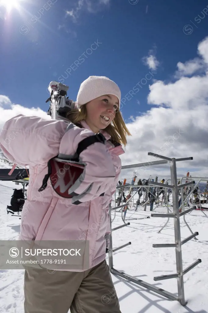 Young girl gets ready to ski