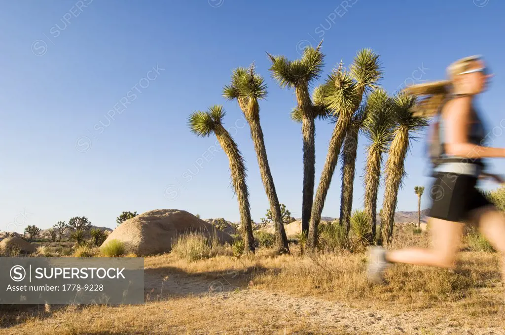 A woman runs in Joshua Tree National Park, California