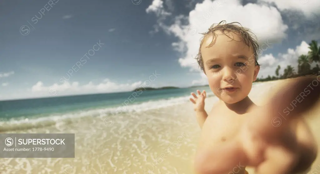 Young boy having fun on the beach in Vieques, Puerto Rico