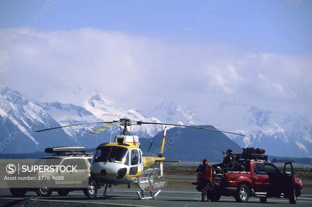 Heli skiers unload their gear in Haines, Alaska