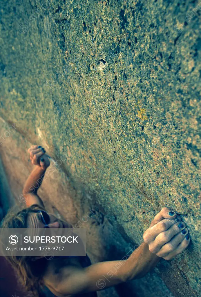 Woman rock climbing, Utah (cross processing effect applied in Photoshop)