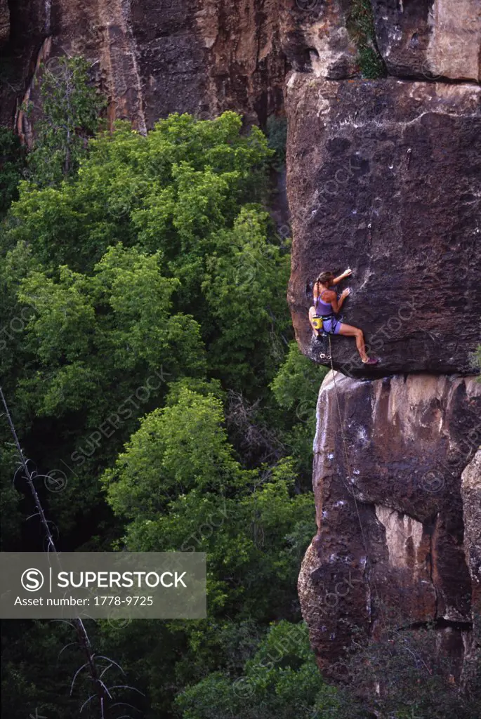 Woman rock climbing, Utah
