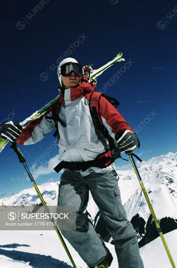 Young woman hiking with skis