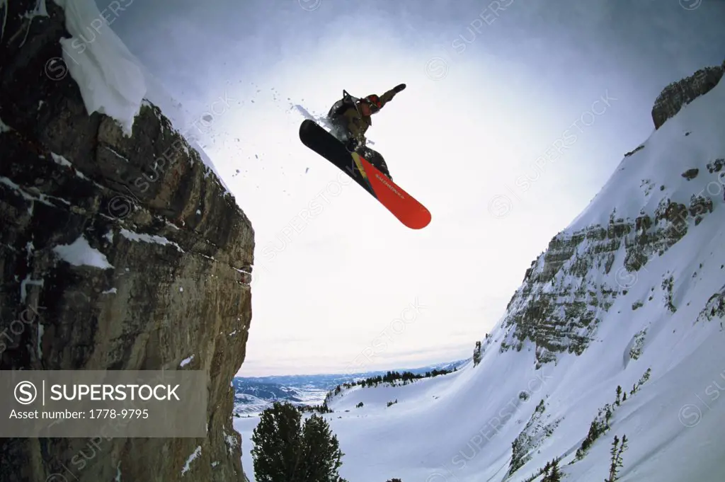 Snowboarder launches a cliff