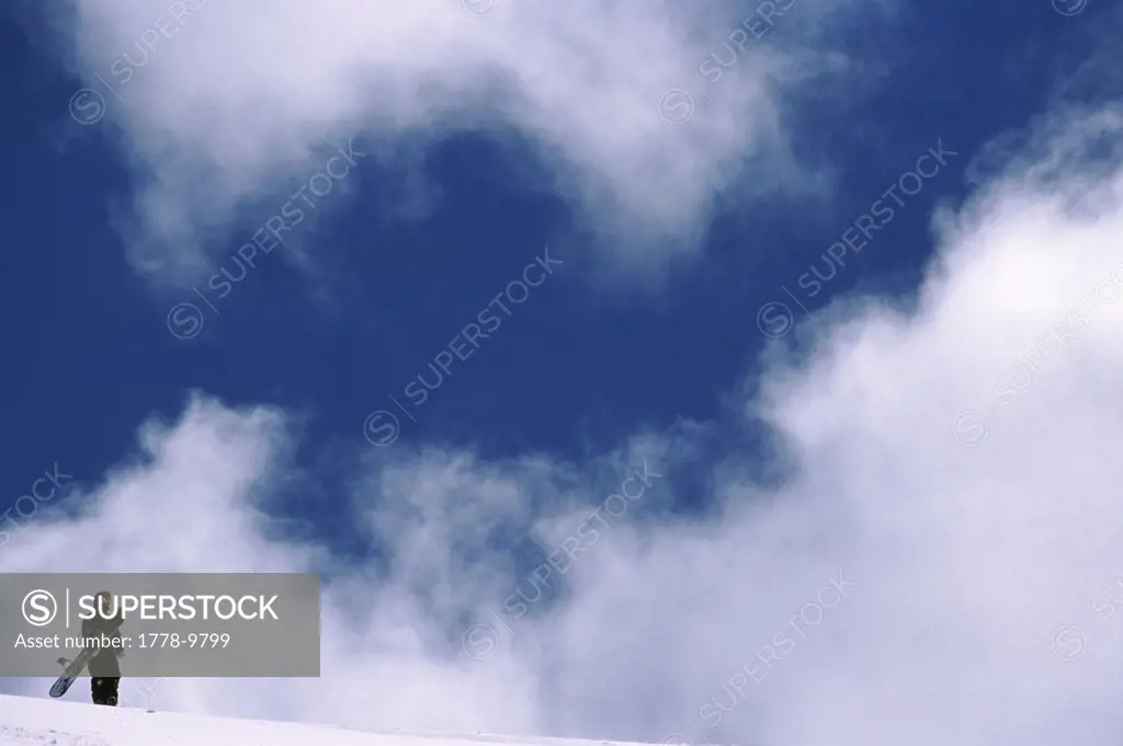 Snowboarder on top of mountain