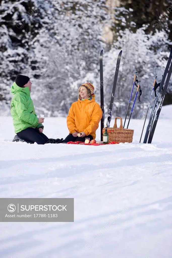 Couple on picnic during ski trip.
