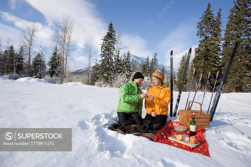 Couple on picnic during ski trip.