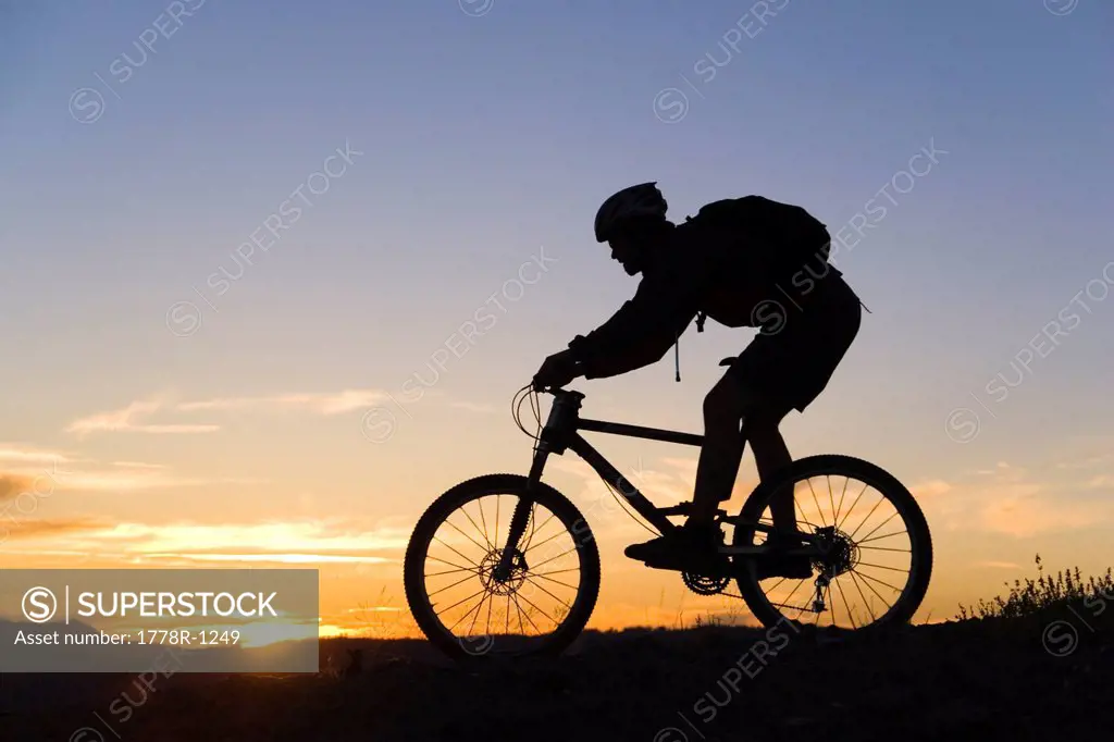 Mountain biking at sunset in California.