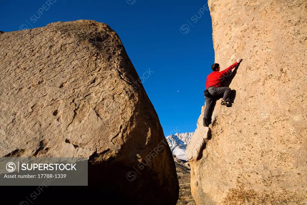 Male climber bouldering.