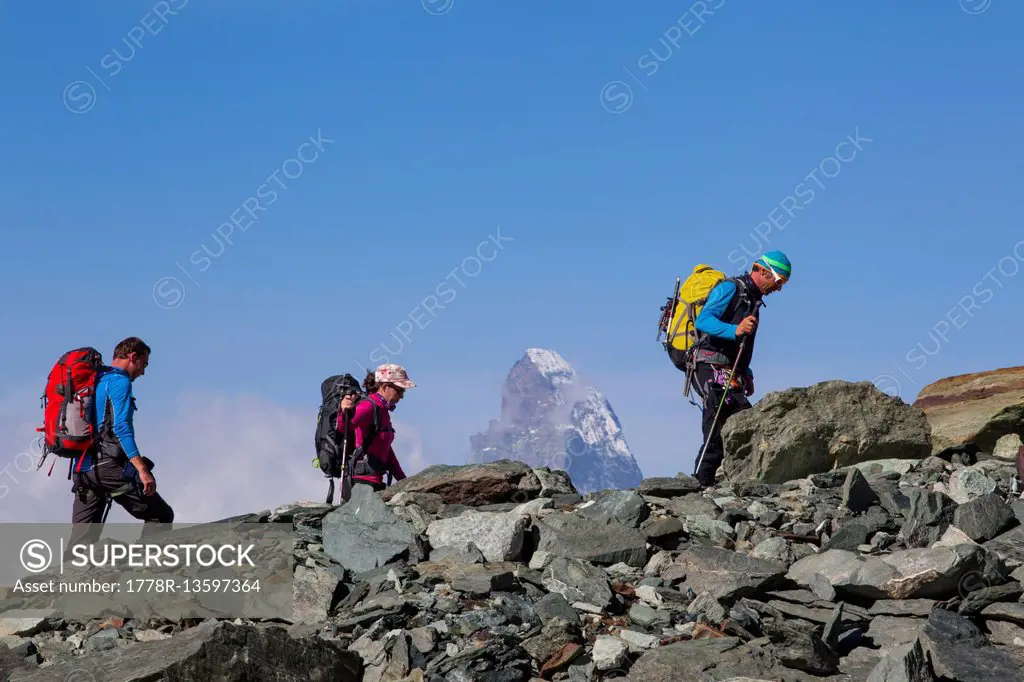Alpinists enroute to a mountain hut with the Matterhorn in the background