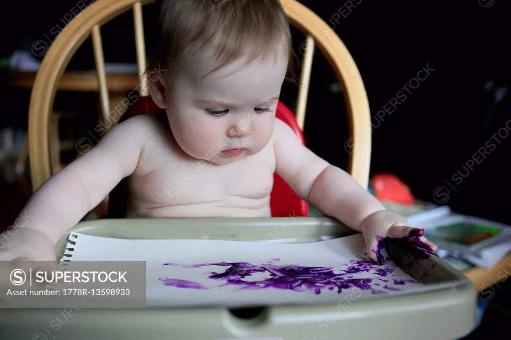 8 month old finger painting at home.