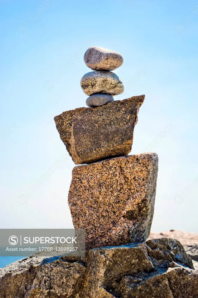 Stacked rocks on the beach of Monument Cove, Acadia National Park, Maine