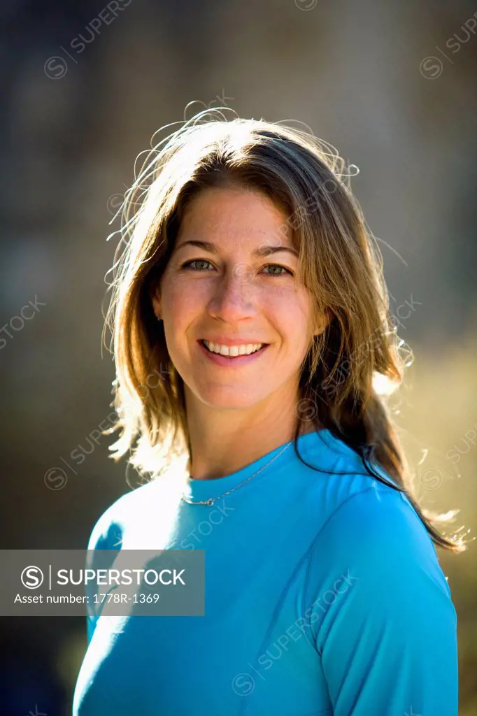 Headshot/portrait of a female climber.
