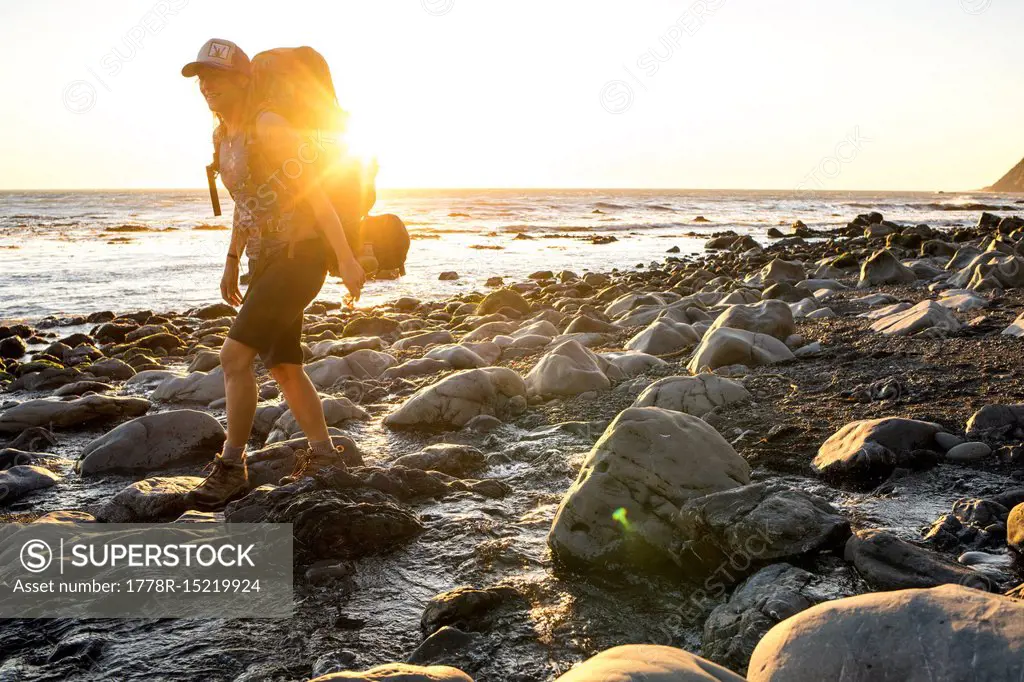 Woman hiking on coastline at Lost Coast Trail, Kings Range National Conservation Area, California, USA
