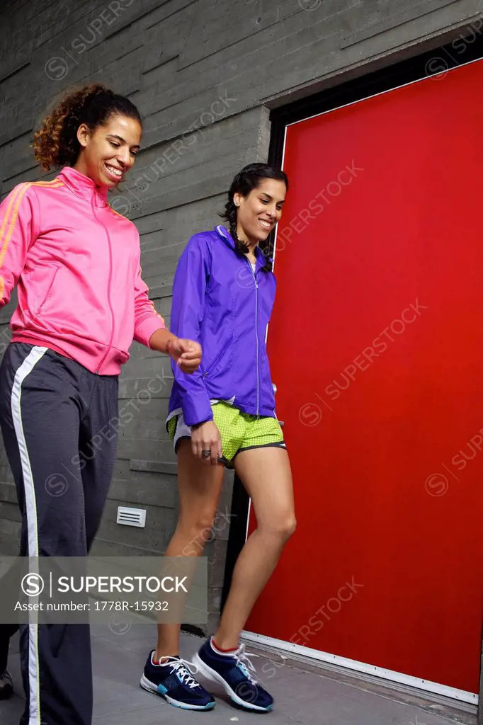 Two girlfriends walking together right after their run in San Diego.