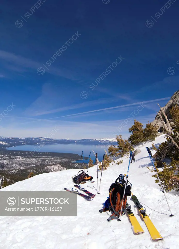 Before skiing down, a group of skiers unbind for a break, in Tahoe City, California.