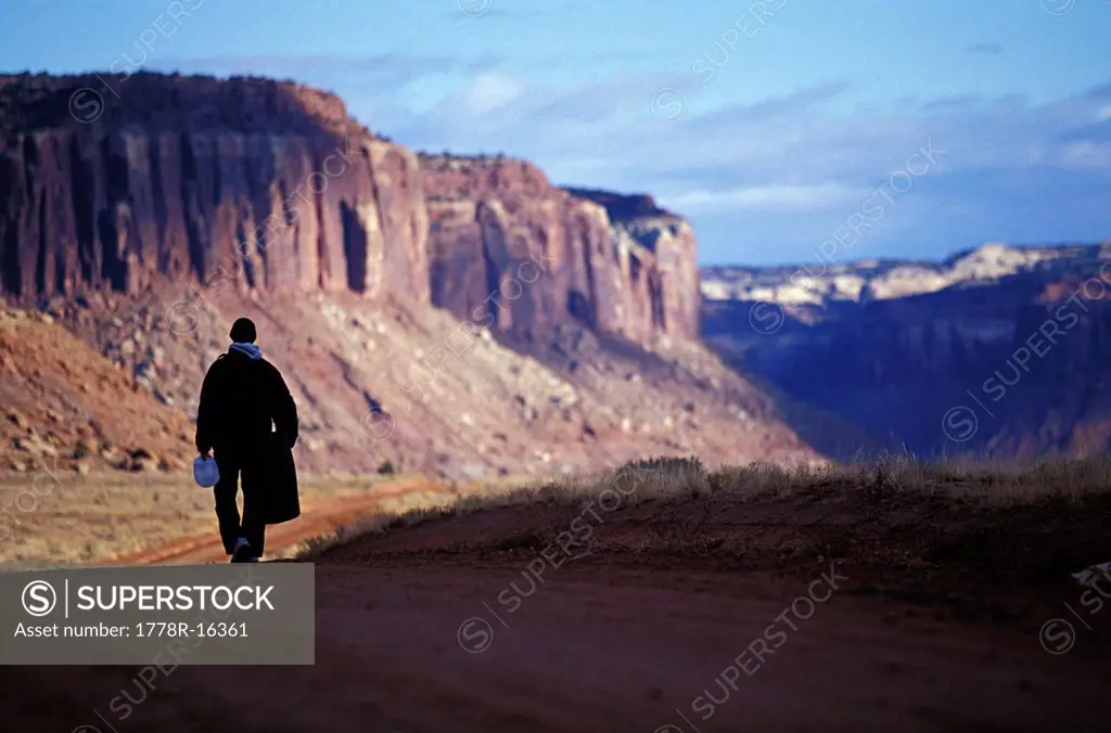 A man looking for boulders to climb, Indian Creek, Utah.