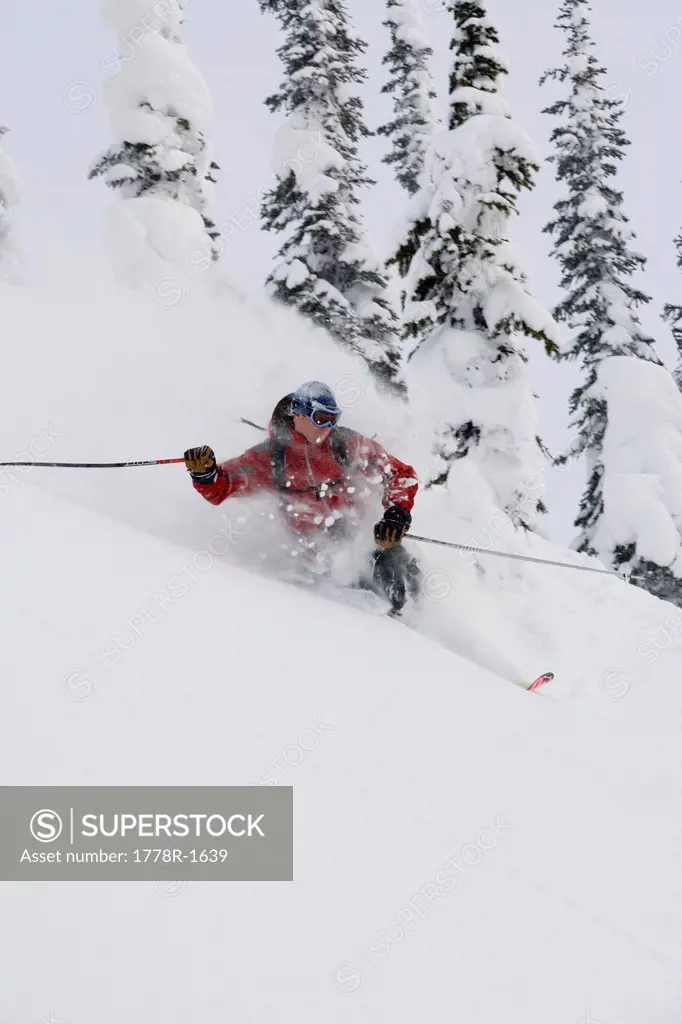 Young man skiing in deep powder.