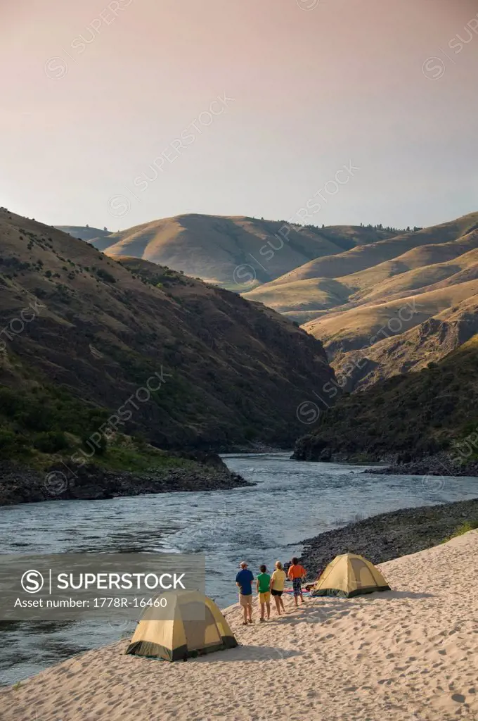 A group white water rafting trip makes camp on the Salmon River.