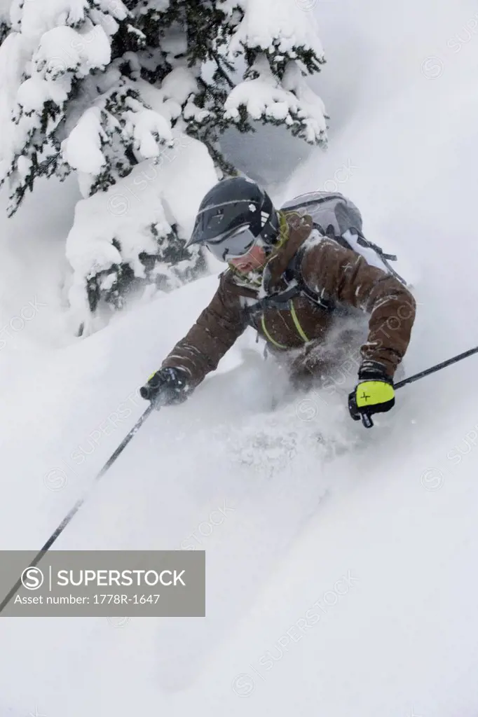 Young woman skiing in deep powder.