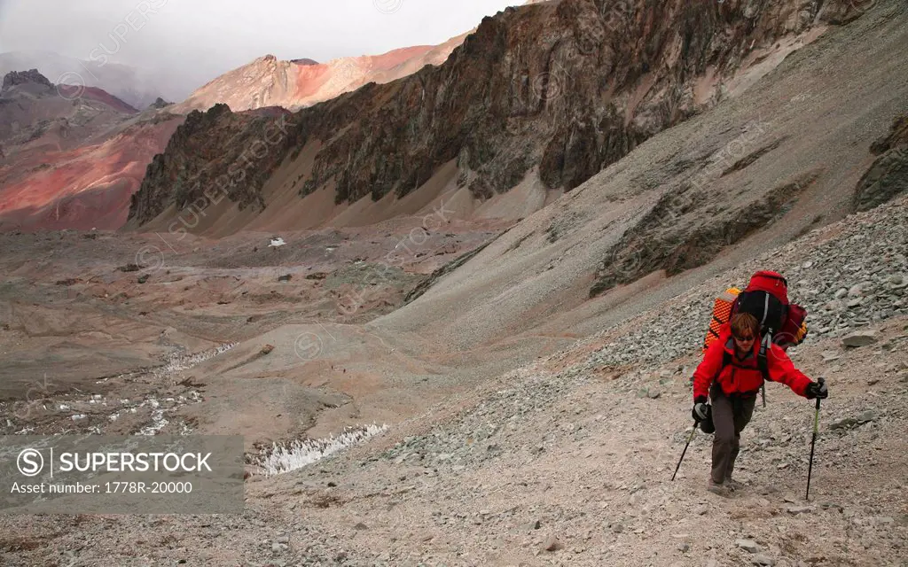 Mountaineer hauling a heavy load between camps on Aconcagua, Andes Mountains, Argentina