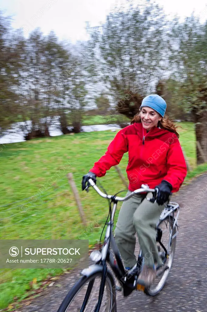 A woman cycles near Gouda, South Holland, Netherlands.