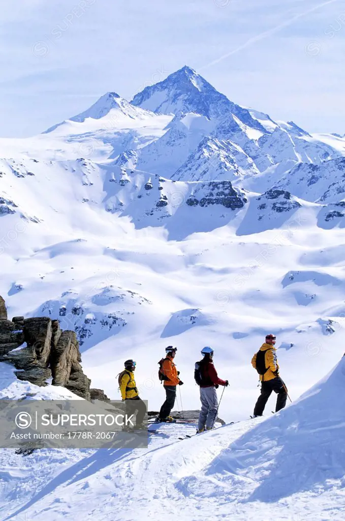 Skiers enjoy view in Switzerland.