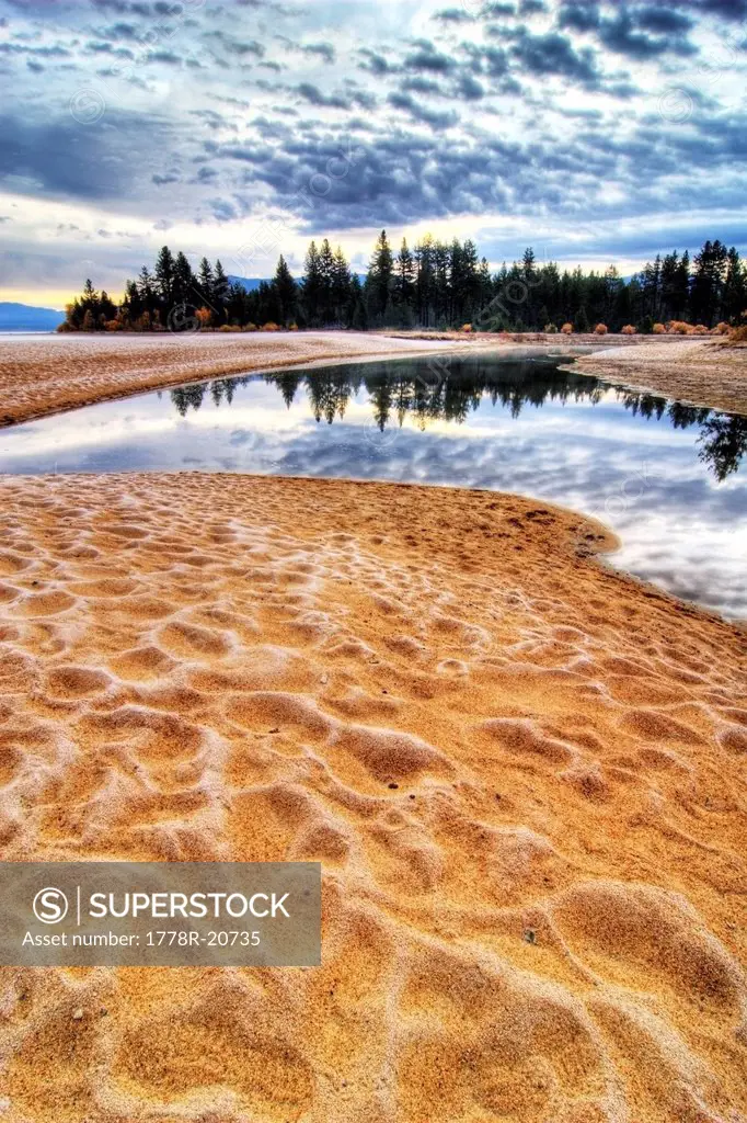 Sunrise with frost covered sand at Taylor Creek on the west shore of Lake Tahoe, CA.