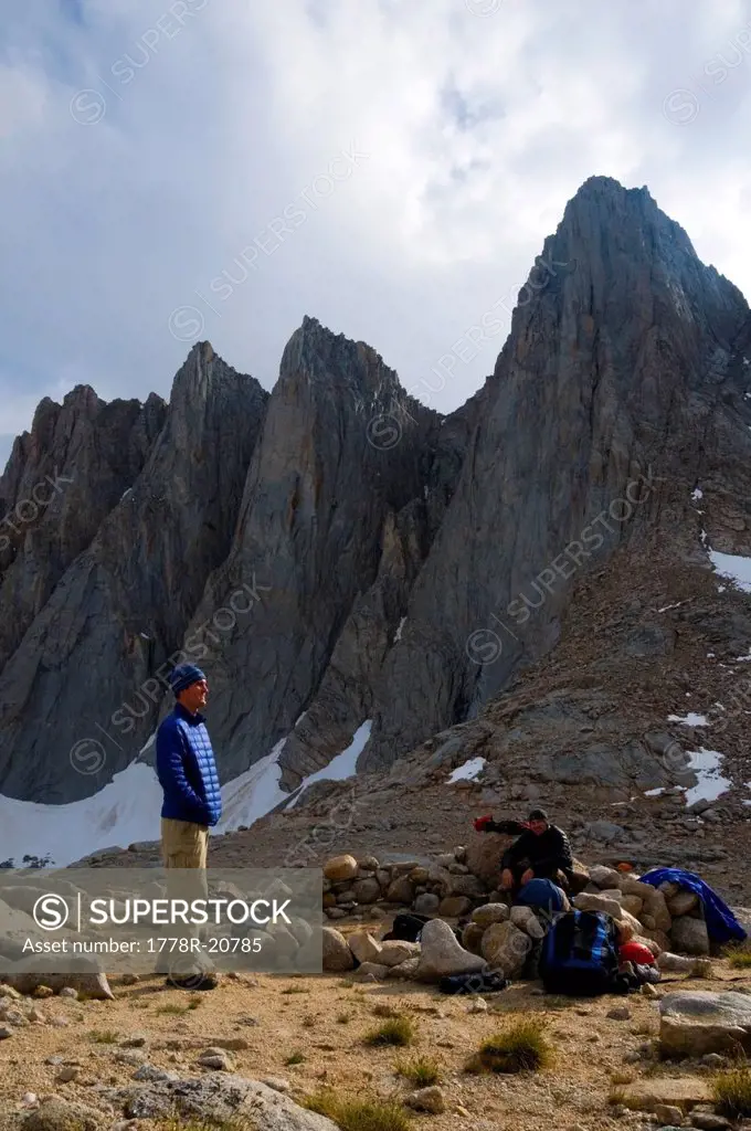 Two men hang out at camp below Mount Whitney in the Eastern Sierra, CA.