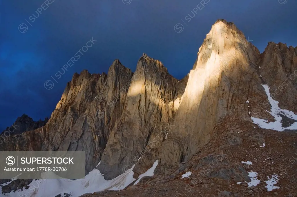 A storm produces dramatic light on Mount Whitney and the Keeler Needle in the Eastern Sierra, CA.