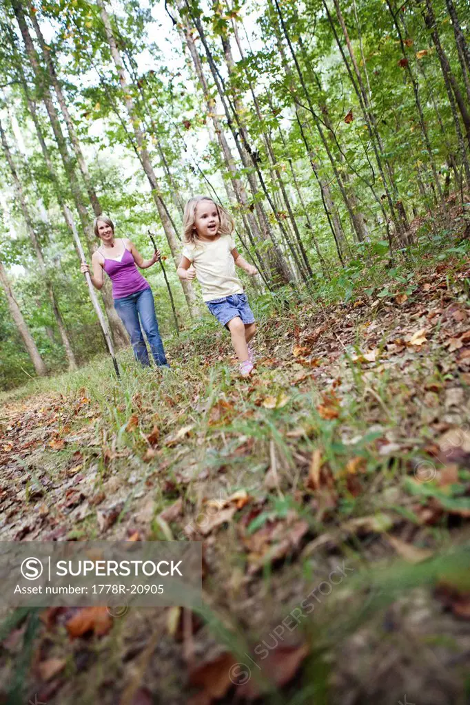 A mother and her young daughter hike through trails in Chelsea, Alabama.