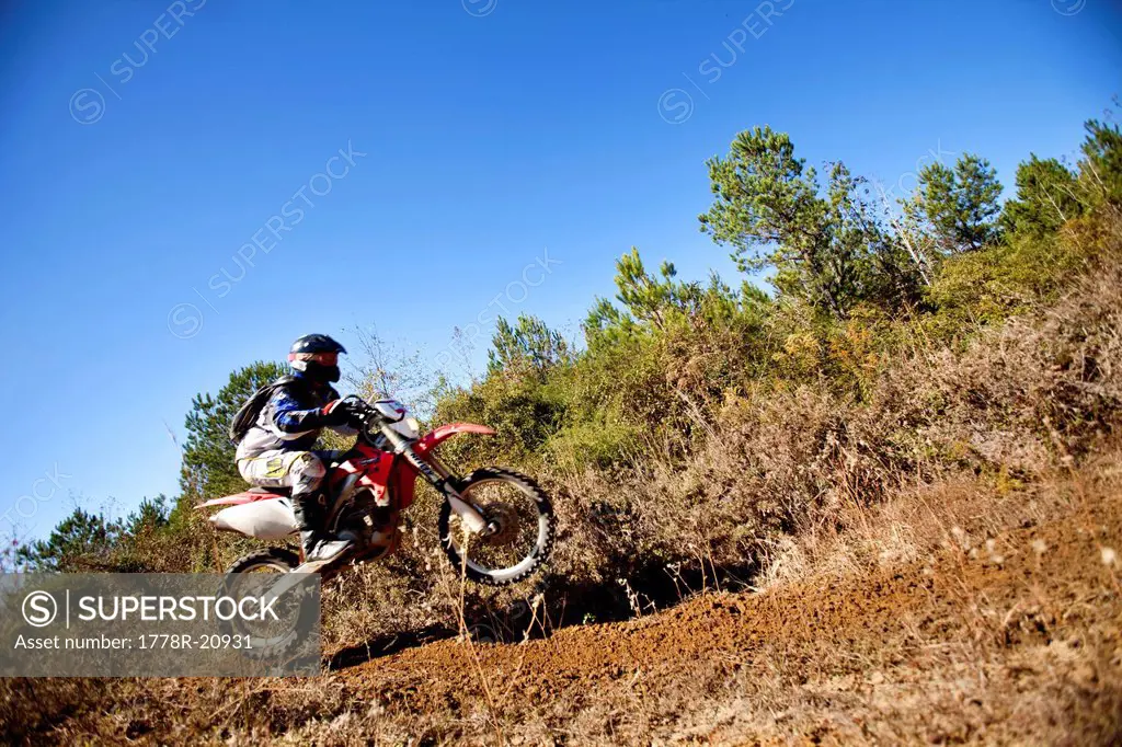 A motorcyclist rides through the brush in an Enduro race in Maplesville, Alabama. Motion Blur