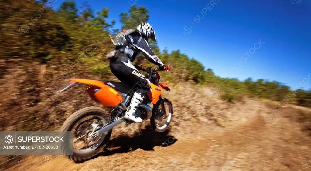 A motorcyclist rides a trail of an Enduro race in Maplesville, Alabama. Motion Blur