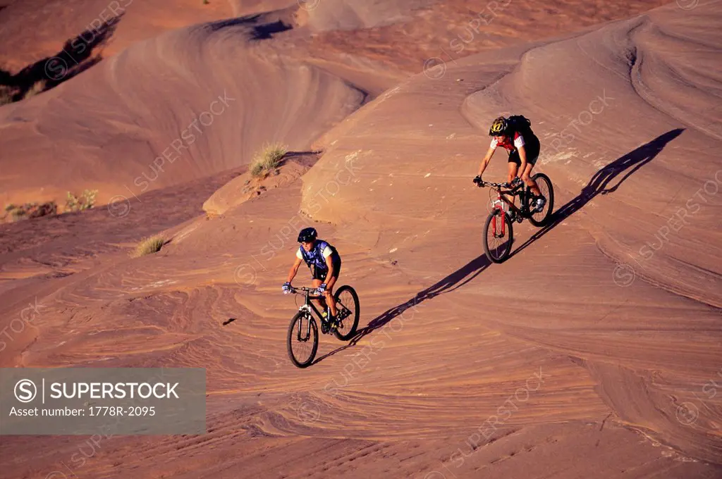Women mountain biking in Moab, Utah.