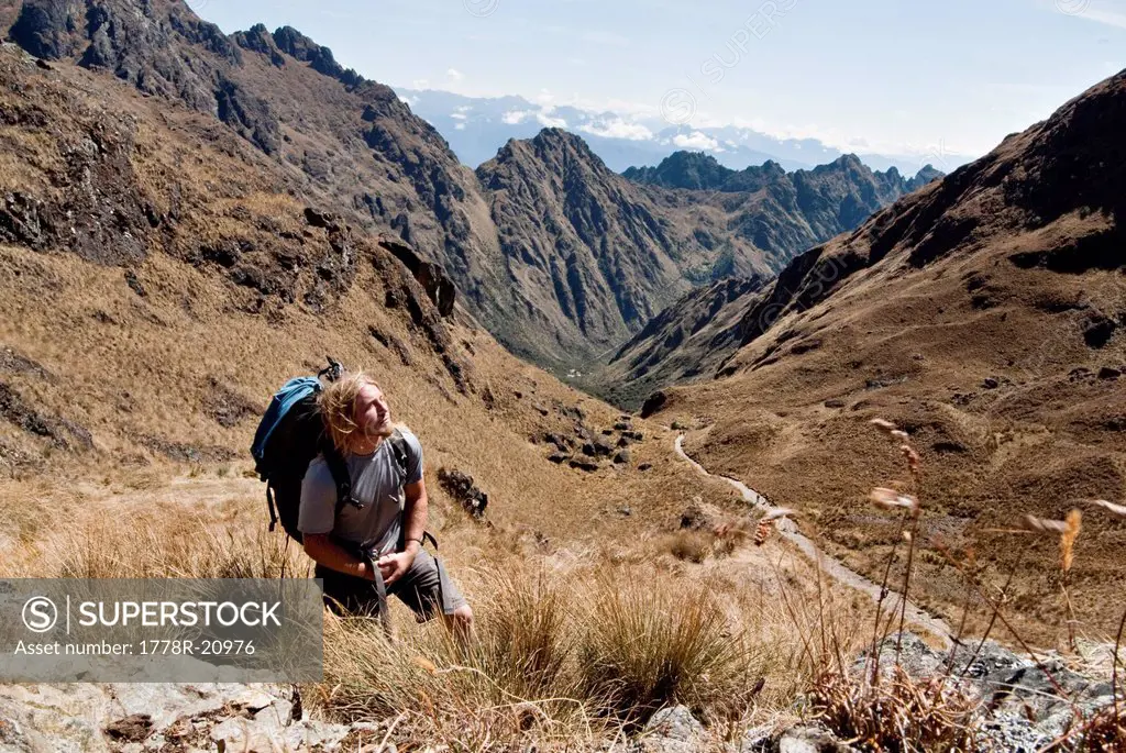A young man reflects at the summit of Dead Woman´s Pass on the Inca Trail.