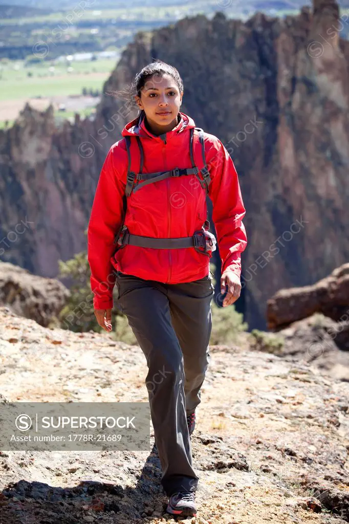 Female hiking rocky trail.