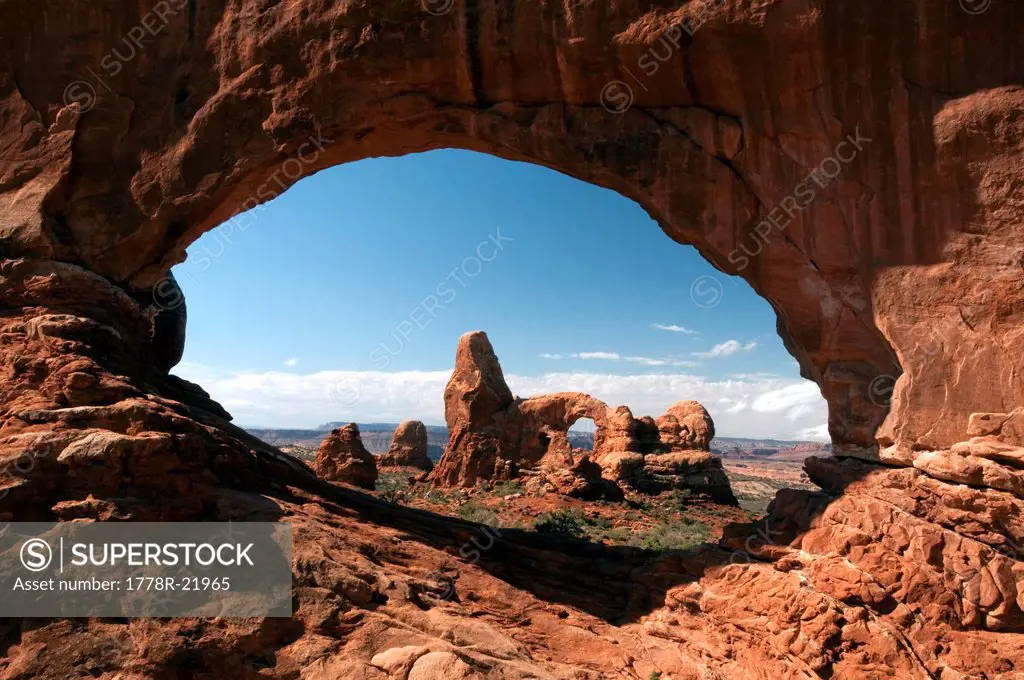 Turret Arch seen through North Window Arch in Arches National Park, Utah.