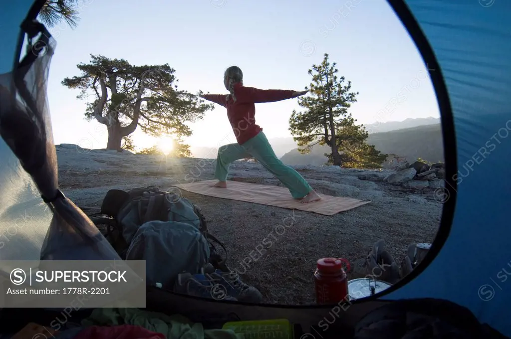 Yoga outside tent at sunrise.