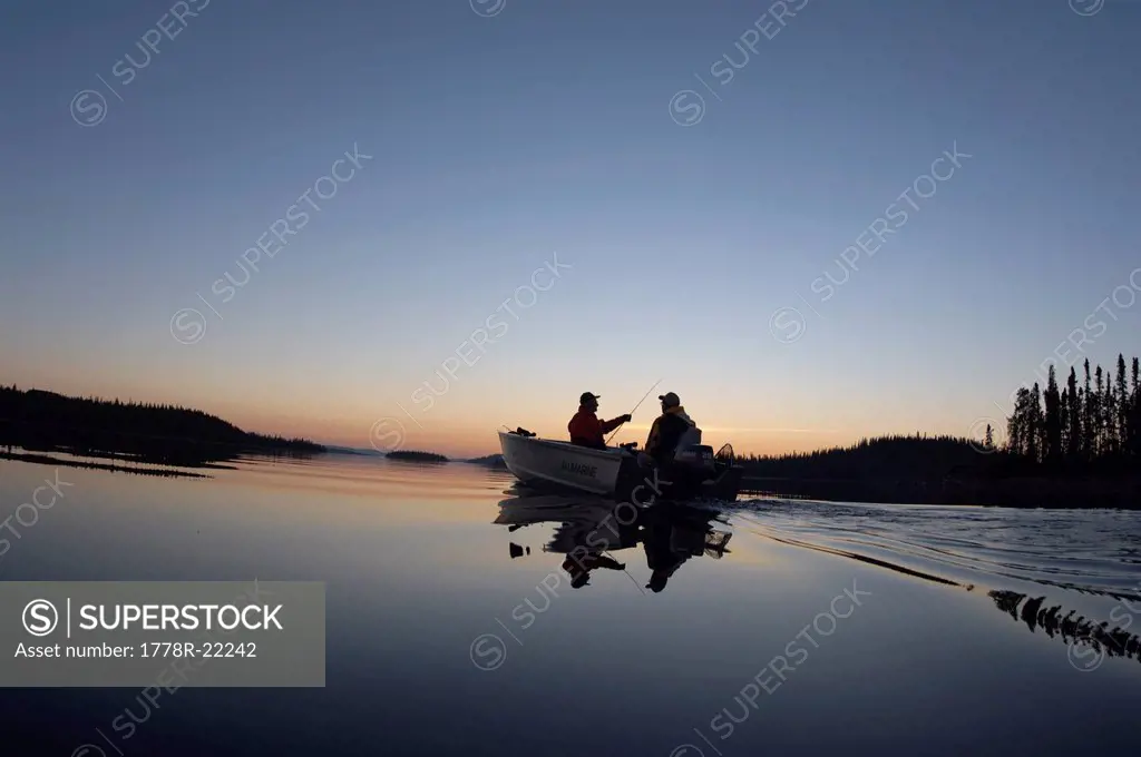 Two guys going fishing at the end of the day in Canada.