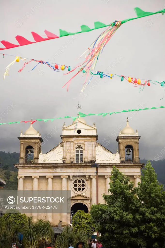 Decorations wave in front of a church in Nahuala, Guatemala.