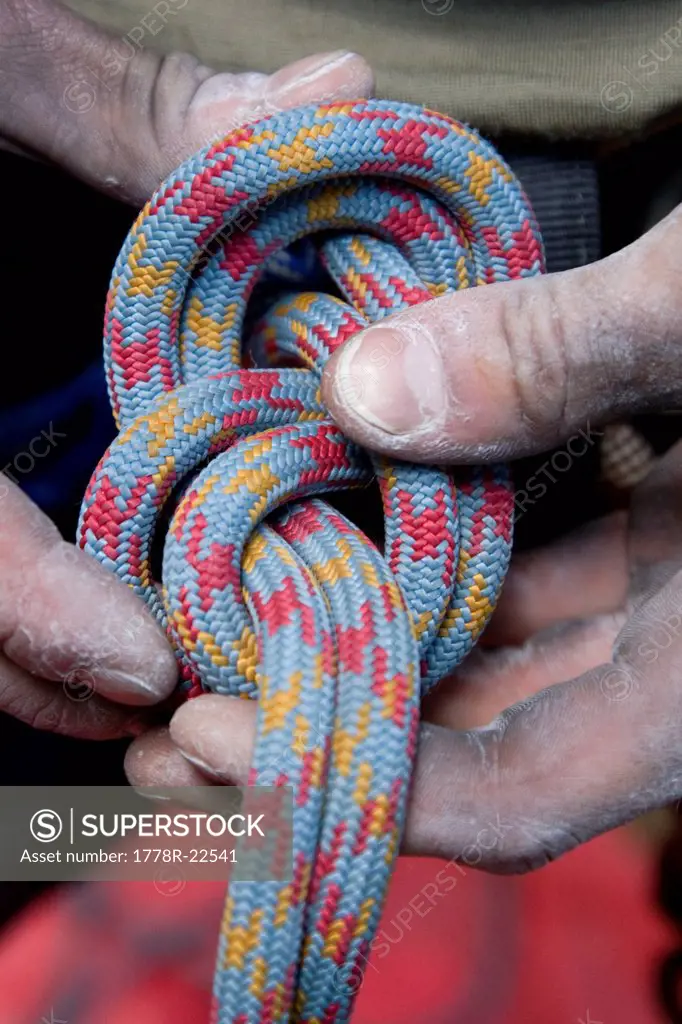 Tying a figure eight 8 knot before climbing, Zig Zag, Oregon.