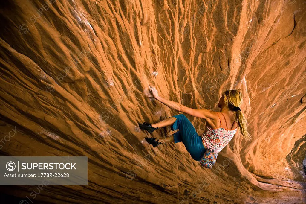 A woman bouldering near Moab, Utah