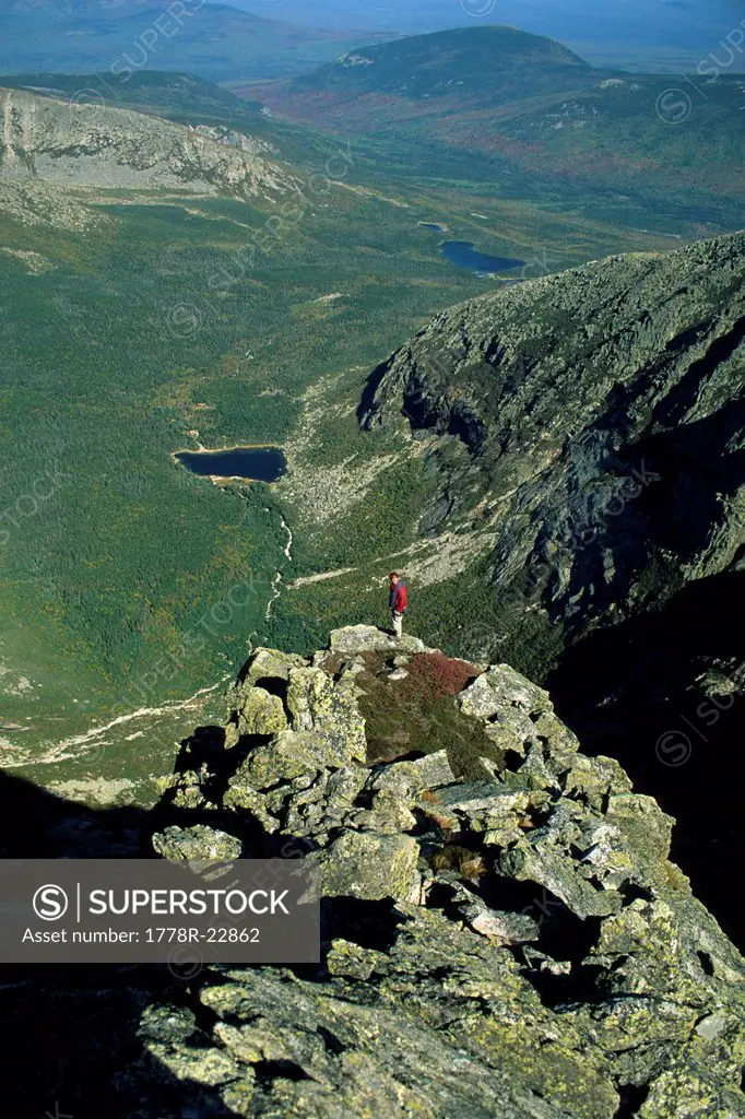 A hiker checks out the view while on the upper section of the Armadillo Ridge on Mt. Katahdin in Baxter State Park, ME