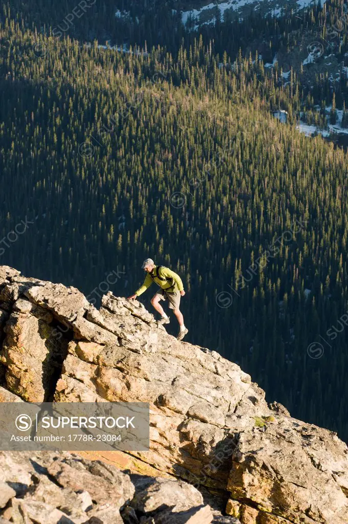 A man hiking near the Rock Cut on the Trail Ridge Road in Rocky Mountain National Park, Estes Park, Colorado.