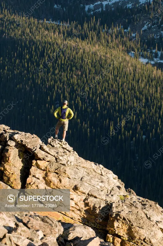 A man hiking near the Rock Cut on the Trail Ridge Road in Rocky Mountain National Park, Estes Park, Colorado.