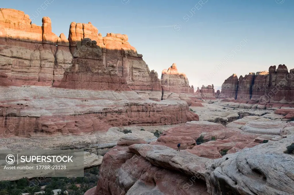 A man hiking in the Needles District of Canyonlands National Park, Monticello, Utah.